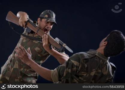 Soldiers fighting over colored background
