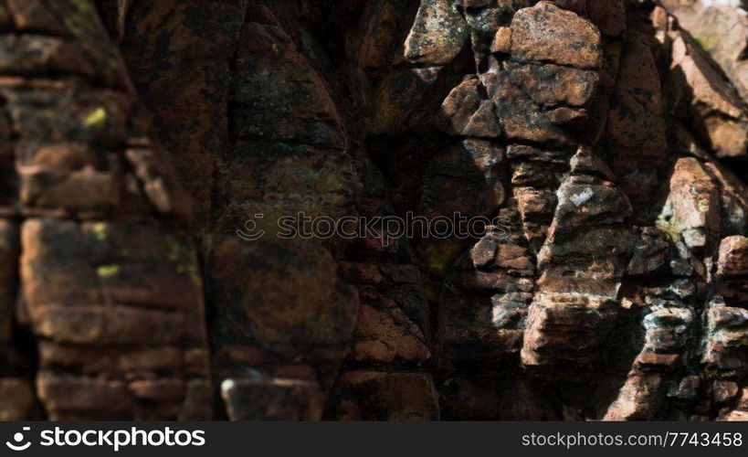 Solid rock with cracks close up