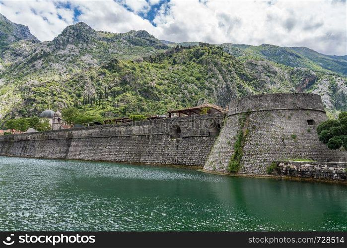 Solid stone walls surround the old town Kotor in Montenegro. Town walls surround the Old Town of Kotor in Montenegro