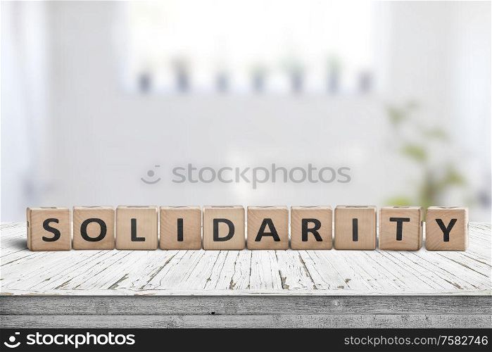 Solidarity message on a wooden table in a bright living room