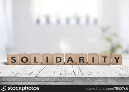 Solidarity message on a wooden table in a bright living room