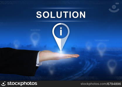 solution button with business hand on blurred background