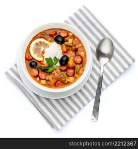 Solyanka - Russian traditional meat soup on white background. Solyanka - Russian traditional meat soup