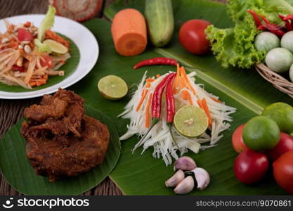 Som Tam Thai -Ingredients Papaya Salad Thai Food Style on wooden table background. Thai Food Concept.