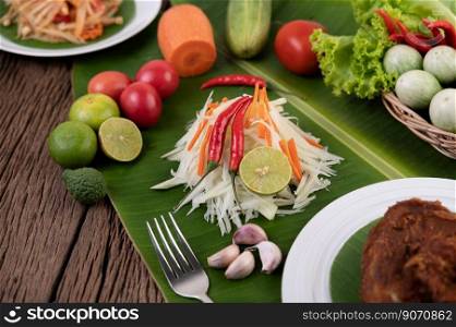 Som Tam Thai -Ingredients Papaya Salad Thai Food Style on wooden table background. Thai Food Concept.