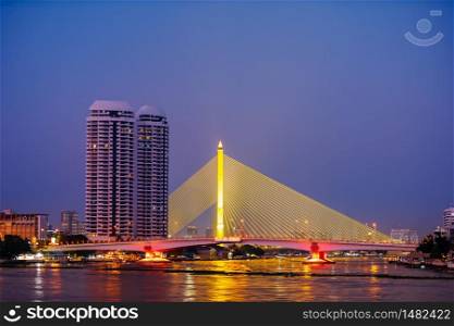 Somdet Phra Pinklao Bridge over the Chao Phraya River at sunset in Bangkok, Thailand