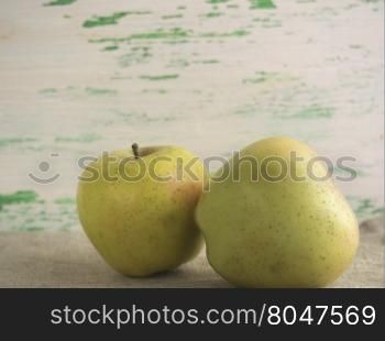 some apples lie on a wooden background. Apples on wooden background