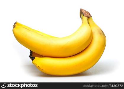 Some bananas over white background