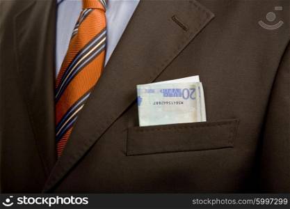 some bank notes in business man pocket