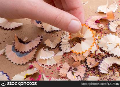 Some colorful pencil shavings in hand