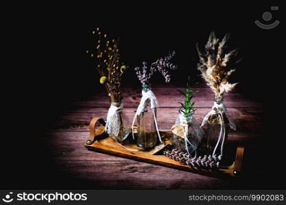 Some flowers on a wooden table