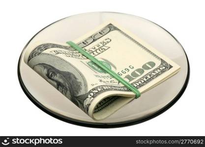 Some hundreds US dollars on a glass saucer