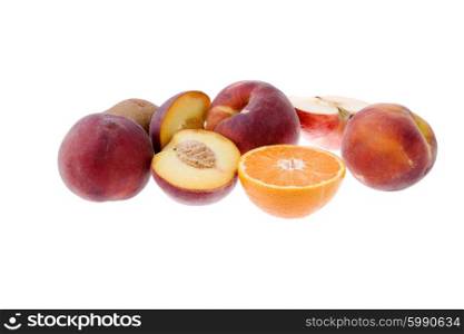 some peaches and a orange isolated on white background