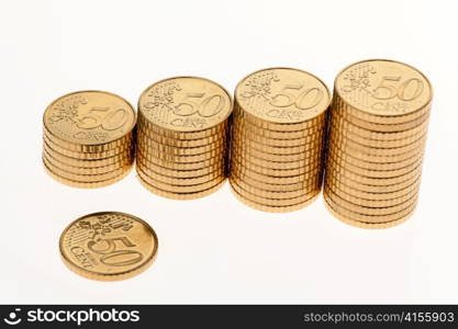 some piles of coins on white background ?