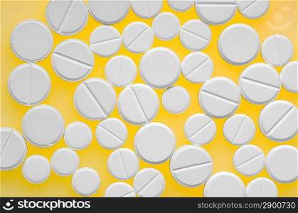 Some pills over color background