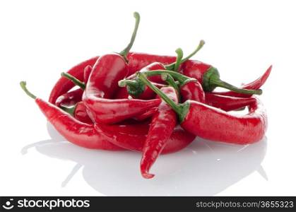 Some red hot peppers on a white background
