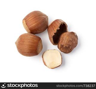 Some shelled hazelnuts with shell , isolated on a white background, with clipping path