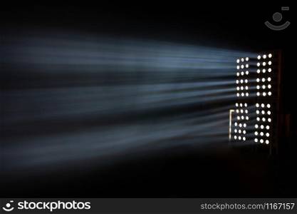 Some spotlights illuminating the dark area with rays of light at night. Spotlight at night