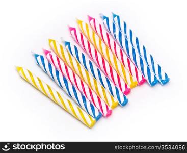 some striped birthday candles on white background