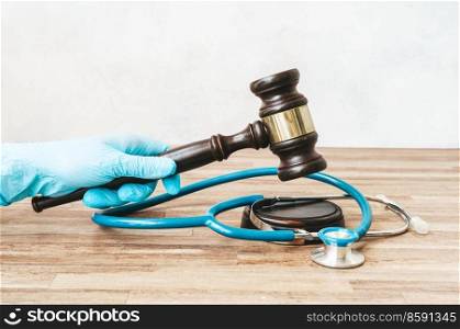 someones hand with law gavel in hand, medical law concept. medical law concept