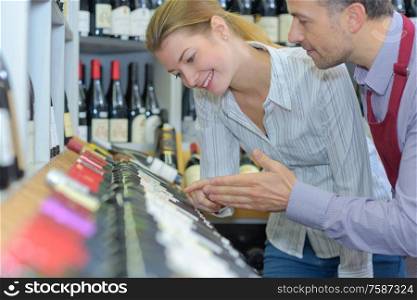 sommelier helping a client to choose wine