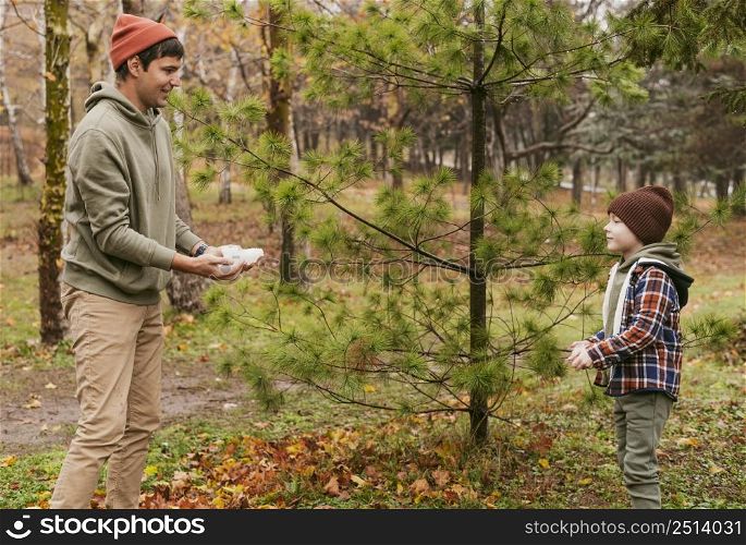 son father playing outdoors nature together