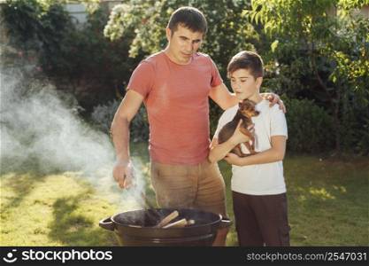 son father preparing food together picnic