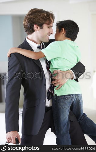 Son Greets Father On Return From Work