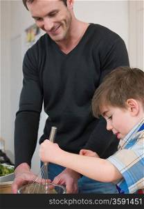 Son Helping Father in Kitchen