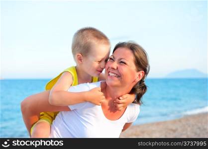 son hugging his mother on holiday