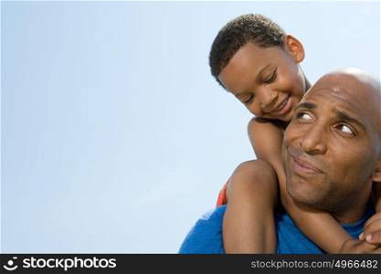 Son on fathers shoulders
