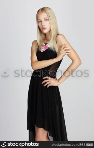 Sophisticated Lady in Black Silky Evening Dress Gracefully Posing