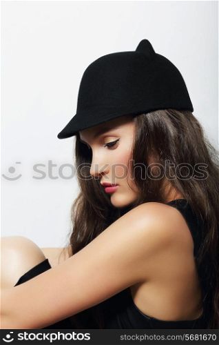 Sophisticated Snazzy Lady in Woolen Cap Sitting