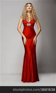 Sophistication. Seductive Woman in Red Fashion Dress. Charisma