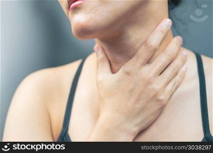 Sore throat pain women. Woman hand touching neck with sore throa. Sore throat pain women. Woman hand touching neck with sore throat feeling bad. Healthcare and medicine concept