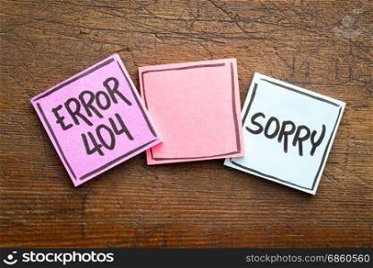 sorry, error 404 - web page not found sign - handwriting in black ink on sticky notes against rustic wood with a copy space