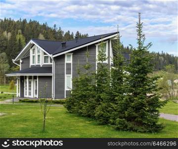 "SORTAVALA, RUSSIA - JUNE 10, 2017: Park-hotel "Dachawintera" Landscape with a cottage in the park"