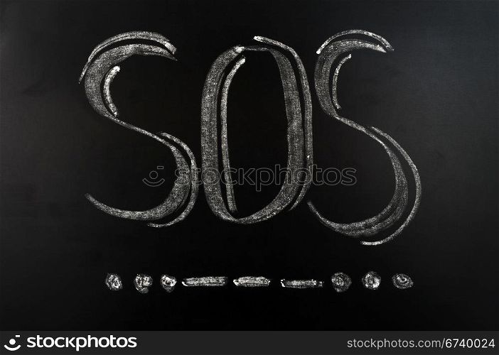 SOS international Morse Code distress signal written on a blackboard