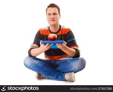Sound mind in healthy body - concept of mental nutrition - man with book and apple white background