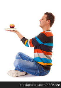 Sound mind in healthy body - concept of mental nutrition - man with book and apple white background