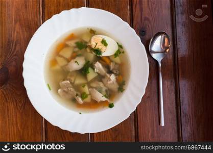 Soup dish over the wooden background