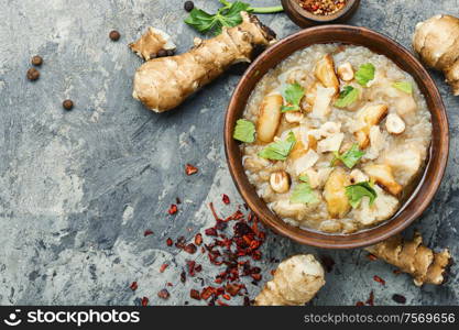 Soup of Jerusalem artichoke and cauliflower.Vegan cream soup in ceramic bowl. Vegetarian Jerusalem artichoke soup
