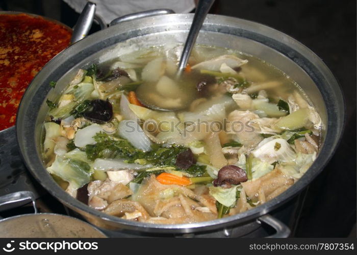 Soup on the stall of traditrional street market in Cambodia