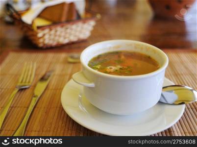 Soup. Soup in a cup on a bamboo tray