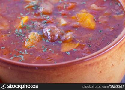 Soup with beans in crock pot, close up