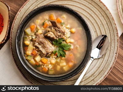 Soup with beef, chickpea and vegetables, top view