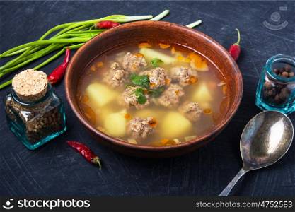 soup with meat balls. Meat soup with soup with meat balls in clay dish.Russian food