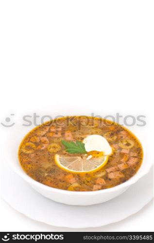 soup with pickled cucumbers and sausages over white background
