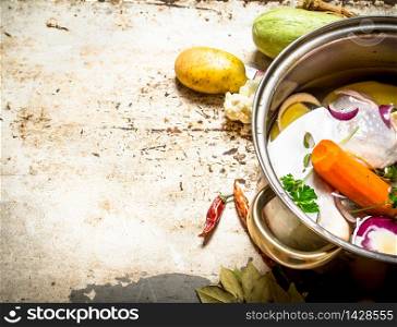 Soup with vegetables and chicken. On rustic background .. Soup with vegetables and chicken.