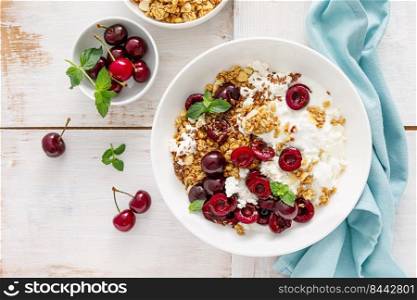 Sour cherry granola with cottage cheese and yogurt. Healthy food, diet breakfast